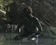 Woman sitting in pool putting on mud SD Footage