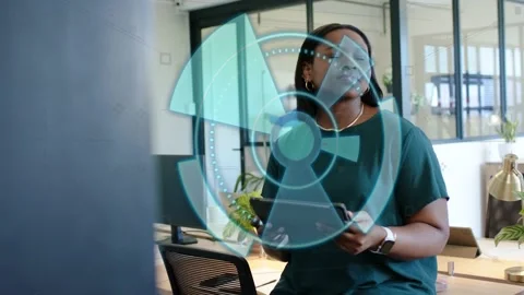 Woman sitting stool, tapping tablet and holding handset, initiating rotating HUD Stock Footage 329959716