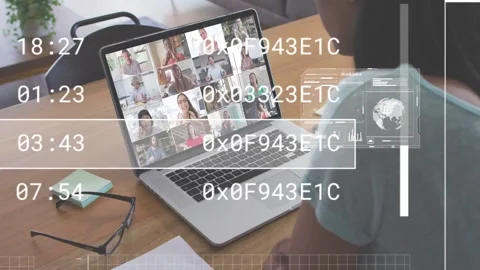 Woman sitting at table joining tech call on laptop reviewing data while HUD Stock Footage 333078361