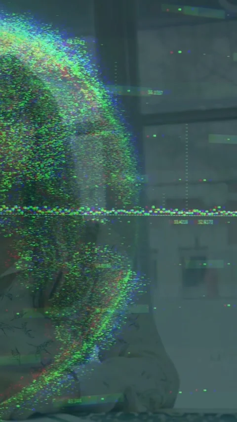 Woman sitting table while RGB halo appearing, moving across face and showing Stock Footage 331168897