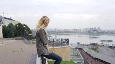 Woman Sitting on the Viewing Platform Overlooking the City of Kazan Stock-Footage 68569520