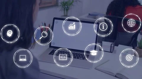 Woman sitting while software loading, AR icons forming grid over laptop and desk Stock Footage 332936523