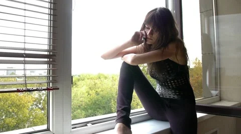 Woman Sitting On Window Ledge 스톡 동영상 63280813