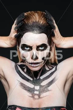 Woman with skeleton halloween makeup Stock Photos