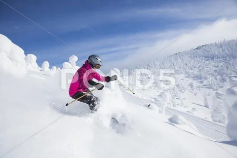 Woman Skiing In Mountains