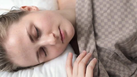 Woman sleeping in bed Stock Footage 72365645