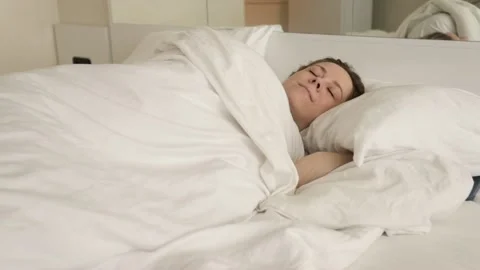 Woman sleeping in bed with phone Stock Footage 239841253