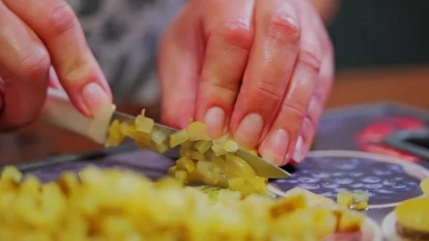Woman Slices Pickles Into Tiny Cubes on Cutting Board – Slow Motion Kitchen Video stock 314491366