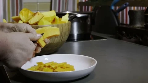 Woman slices a pumpkin Stock Footage