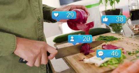 Woman slicing onion in cooking tutorial, showcasing social media reaction icons Stock Footage 310219104