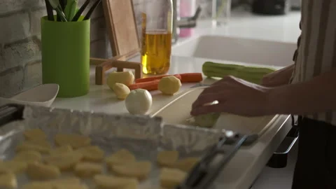 Woman slicing vegetable marrow in the kitchen Stock Footage 201928053