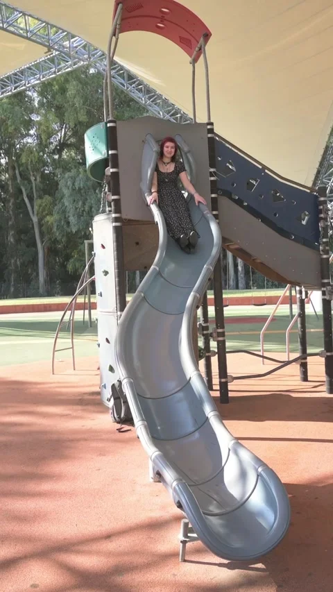 Woman on slide Stock Footage 295744424