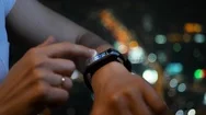 Woman With Smart Watch On Night City Background. 4K Uhd Stock Footage