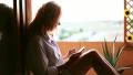 A woman with smartphone on terrace (tracking) HD Footage