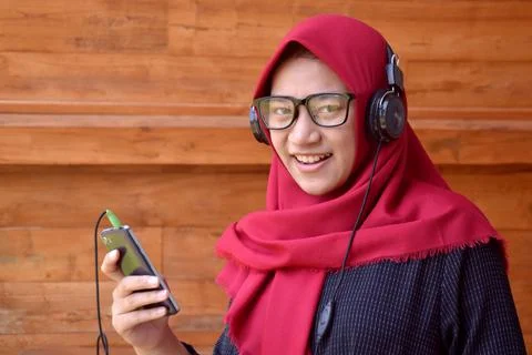 Woman smile play music with headphone Stock Photos