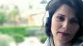 woman smiles with headphones HD Footage