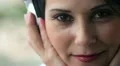 woman smiling and listening to music HD Footage