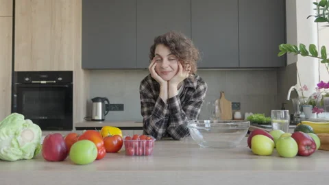 Woman Smiling At Camera As Frame Widens To Reveal Colourful Kitchen Scene Stock Footage 308455019