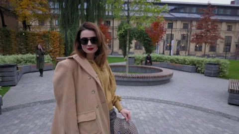 Woman Smiling Charmingly while Standing in the Middle of Modern Urban City Stock Footage 160968495