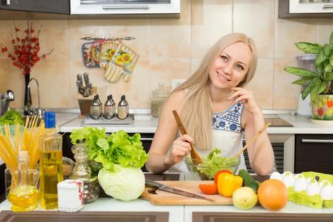 Woman smiling at the kitchen table Stock Photos