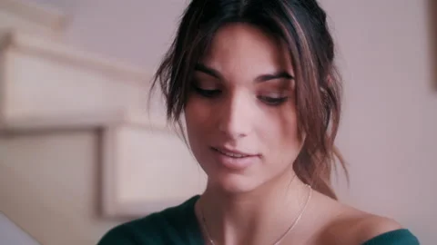 Woman smiling while looking down Video stock 131183112