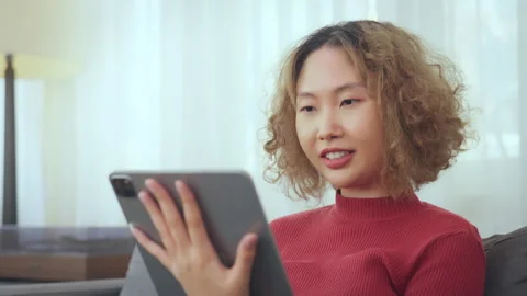 Woman Smiling While Using Tablet Stock Footage 281130330