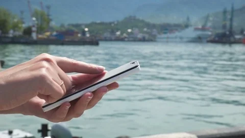 Woman sms texting using app on smart phone at beach Video stock 78095116