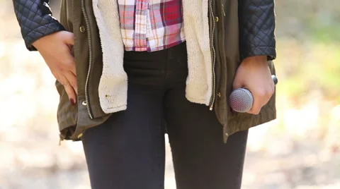Woman snapping her fingers and holding a microphone Stock Footage 59556534