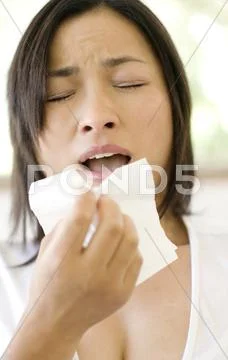Woman sneezing Stock Photos