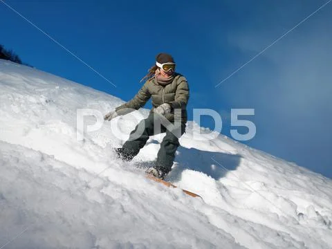 Woman Snowboarding