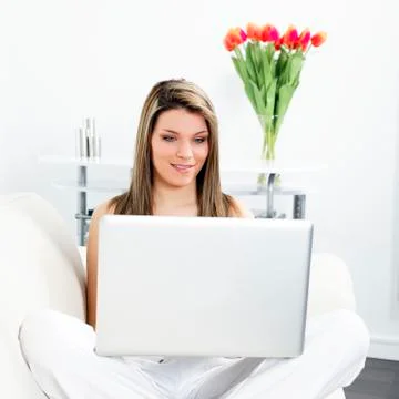 Woman on sofa with computer Stock Photos
