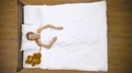 The woman with soft toy lay on the bed. View from above 4k or 4k+ Resolution