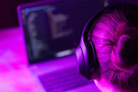 Woman software developer in neon lights Foto stock