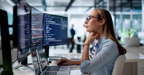 Woman Software Developer Reviews Code Changes Using Visual Merge Tool On Lapt Fotos Stock