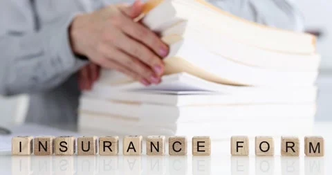 Woman sorting documents on background of wooden cubes with word insurance forms Video stock 178422938