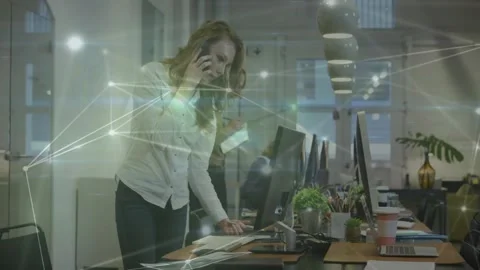 Woman sorting papers, calling and noting, reviewing business files with network Stock Footage 333904209