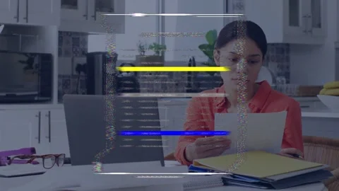Woman sorting papers at kitchen table, HUD fading in overlaying and scanning Stock Footage 335761641