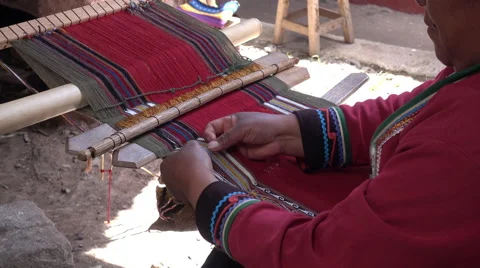 A woman sorting threads of alpaca yarn before weaving Stock-Footage 68780072