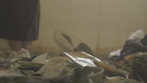 Woman sorting through trash and rubble Stock Footage 88919347