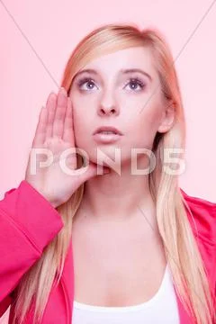 Woman speaking, young girl whispering over pink Stock Photos