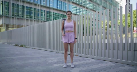 Woman spends weekend actively stands in full length works hard eagers to be Stock Footage 159727753