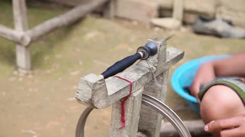 Woman spin yarn thread during warping process Stock Footage 62532880