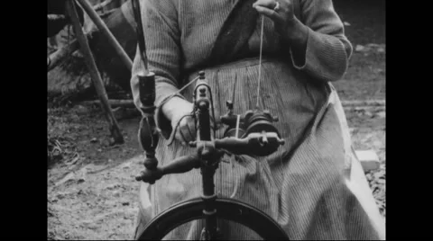 Woman spinning thread on wheel Stock Footage 43323838
