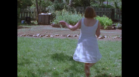 Woman Spins in White Dress Stock Footage