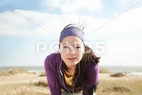 Woman In Sports Clothes By The Sea