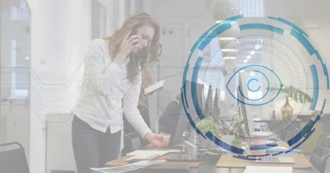 Woman spreading documents at desk causing interface emerging around monitors Stock Footage 327528134