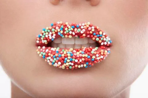 Woman With Sprinkle Candy Lips Stock Photos