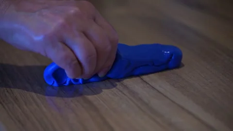 Woman Squeezing Blue Physiotherapy Putty for Broken Arm Rehabilitation Stock Footage 345255016