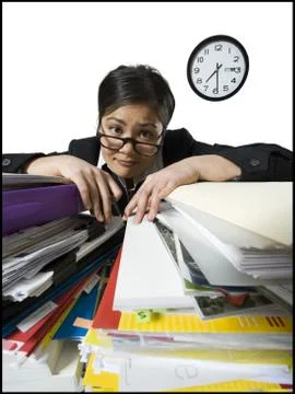 Woman with stack of binders and paperwork Stock Photos
