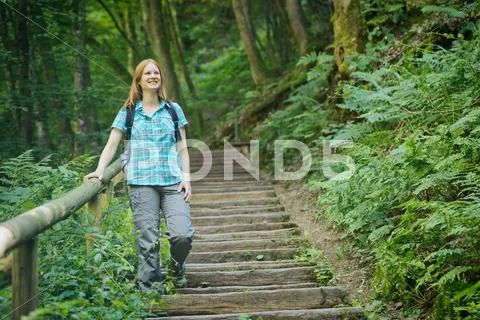 Woman on a Staircase in a Wood Stock Photos